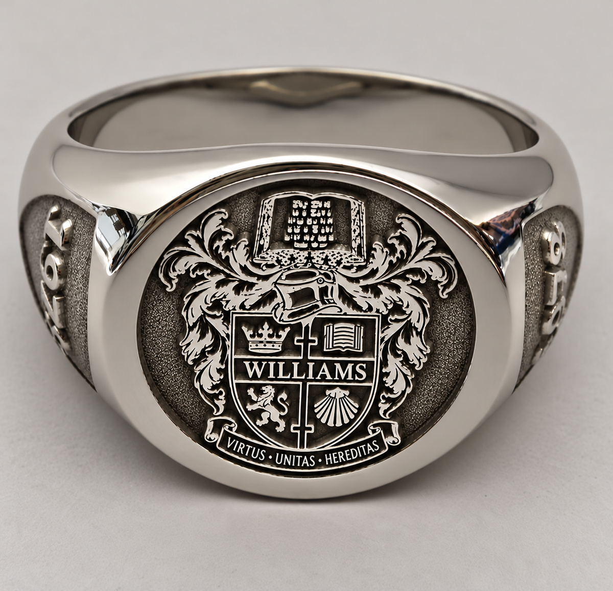 Personalised family crest signet ring with detailed coat of arms engraving and classic silver-tone finish.