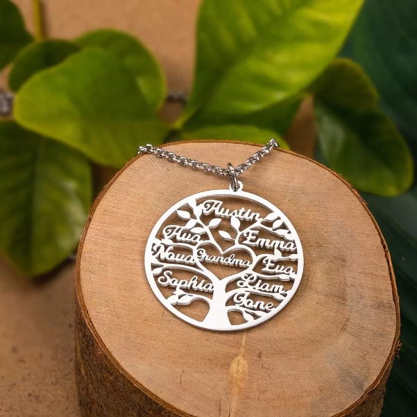 Silver personalized family tree pendant displayed on a wooden stand