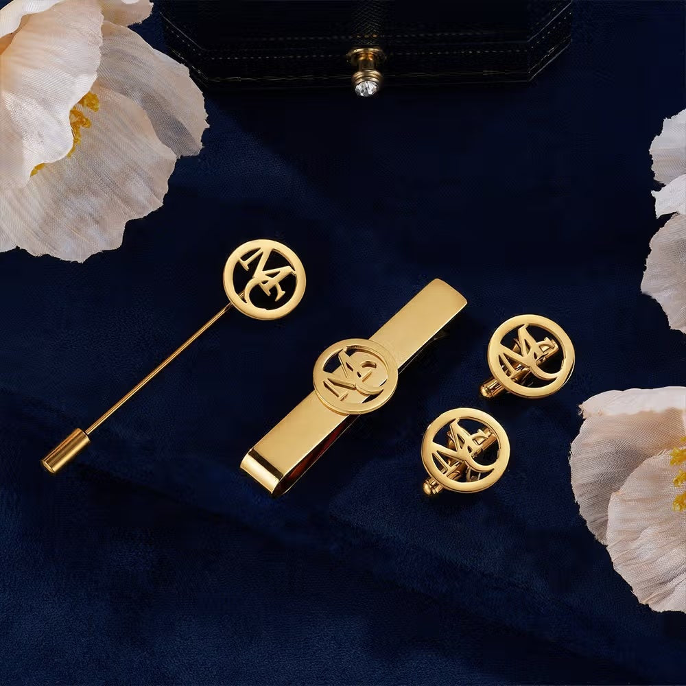 Personalized gold round initial cufflinks with matching tie clip and lapel pin for men's formalwear