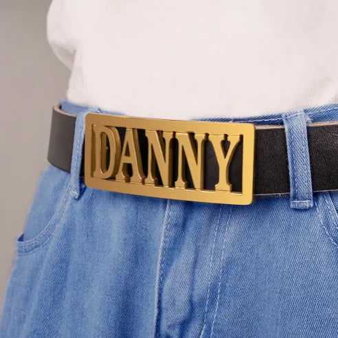 Personalized gold belt buckle with name 'DANNY' on black belt, custom engraved jewelry for gifts