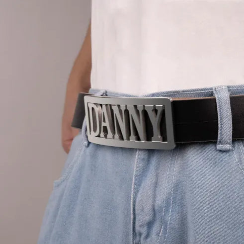Personalized belt buckle with engraved name 'DANNY' on black leather belt, custom gift for men