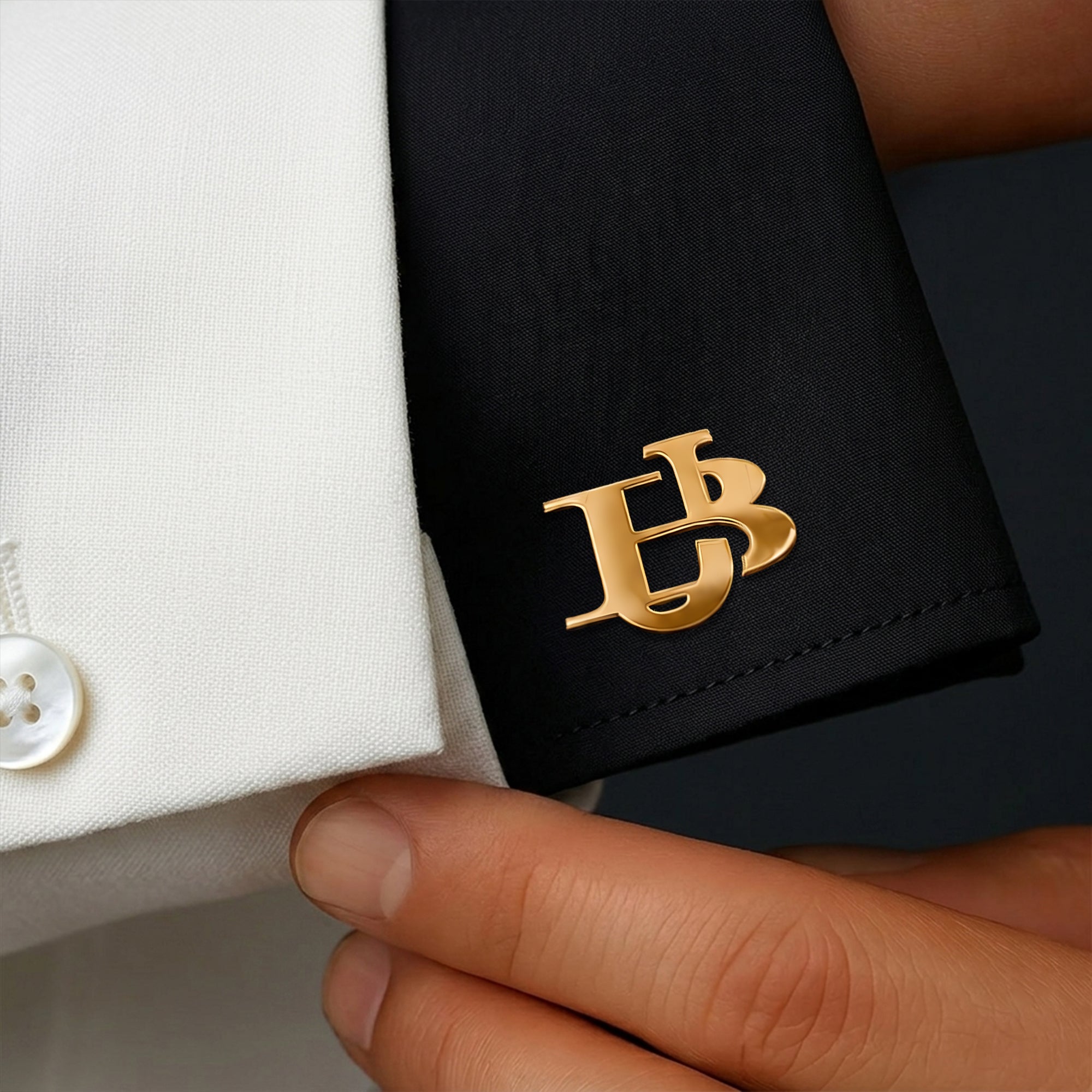 Personalized gold interlocking initials cufflinks shown on a formal shirt cuff