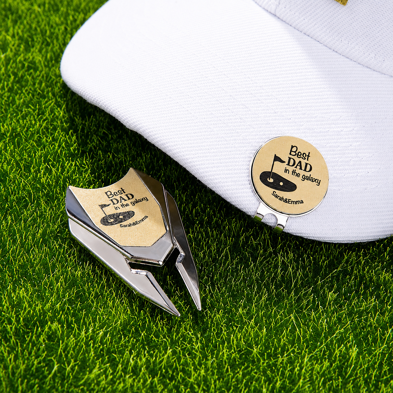 Personalized Best Dad golf divot tool and removable ball marker beside white golf cap
