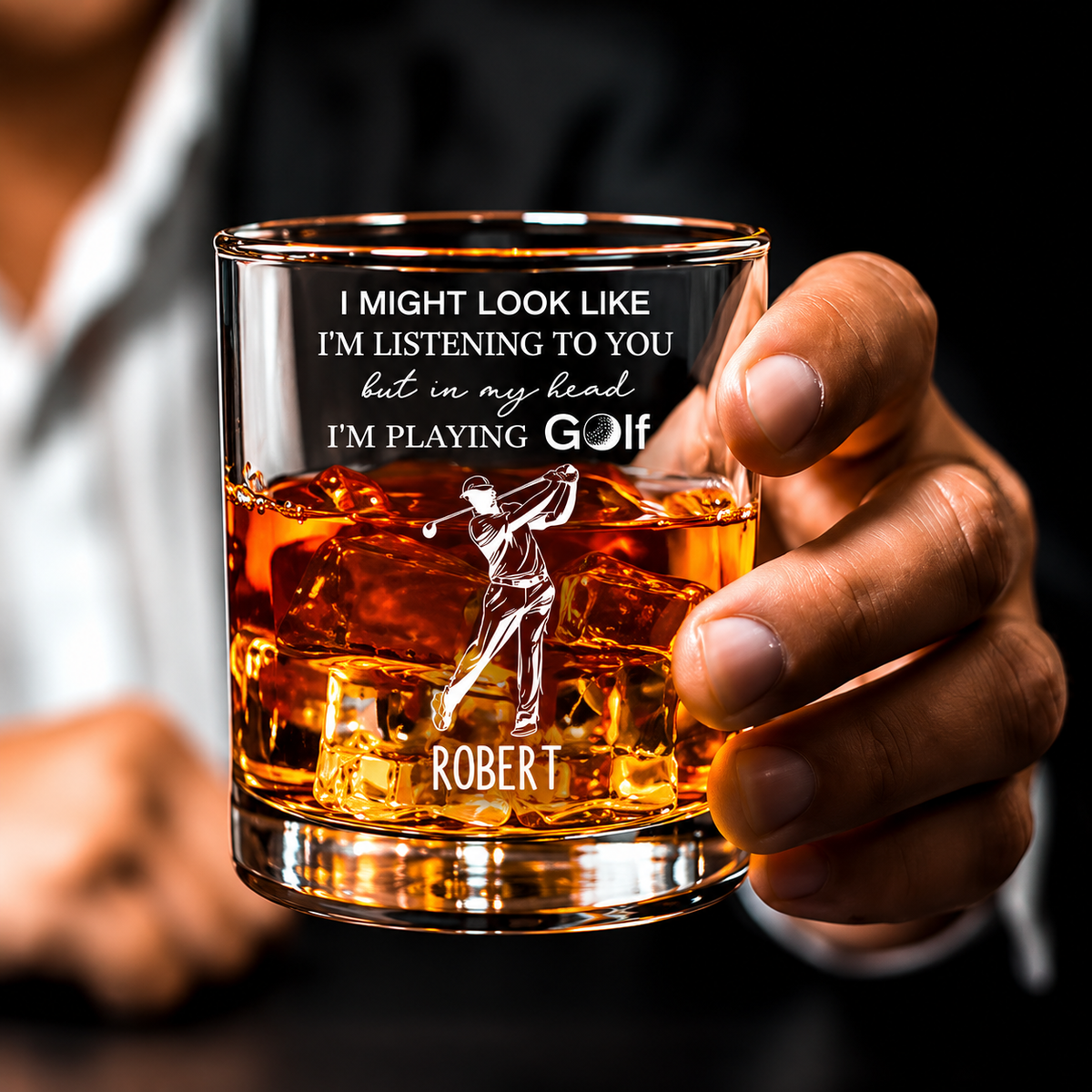 Custom golf whiskey glass with personalized name and golfer design held in hand