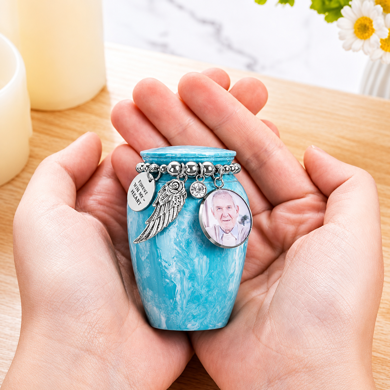Small personalised cremation urn shown in hands to demonstrate size for human or pet ashes keepsake.