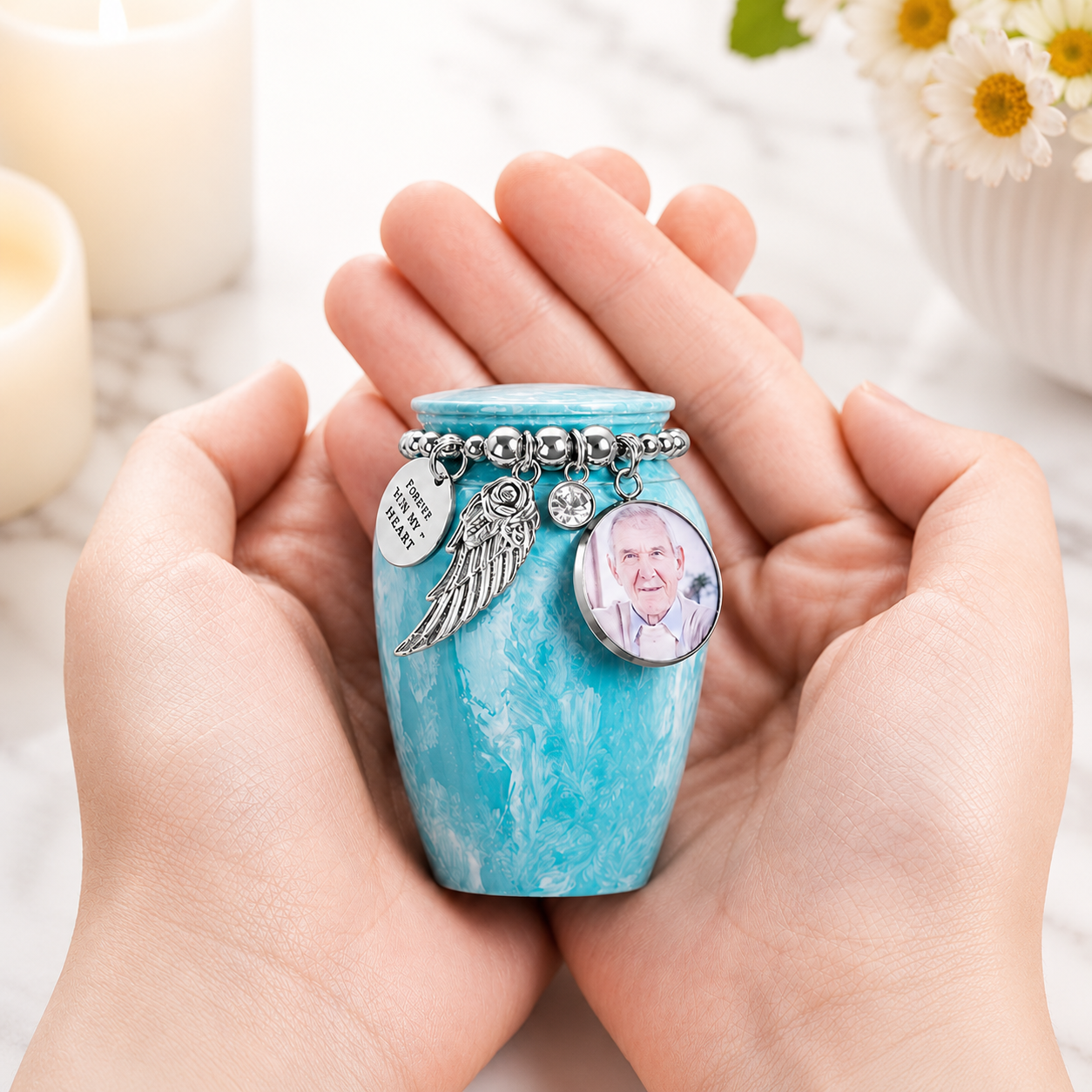 Custom photo mini cremation urn with engraving held in hands, personalised keepsake for human or pet ashes.