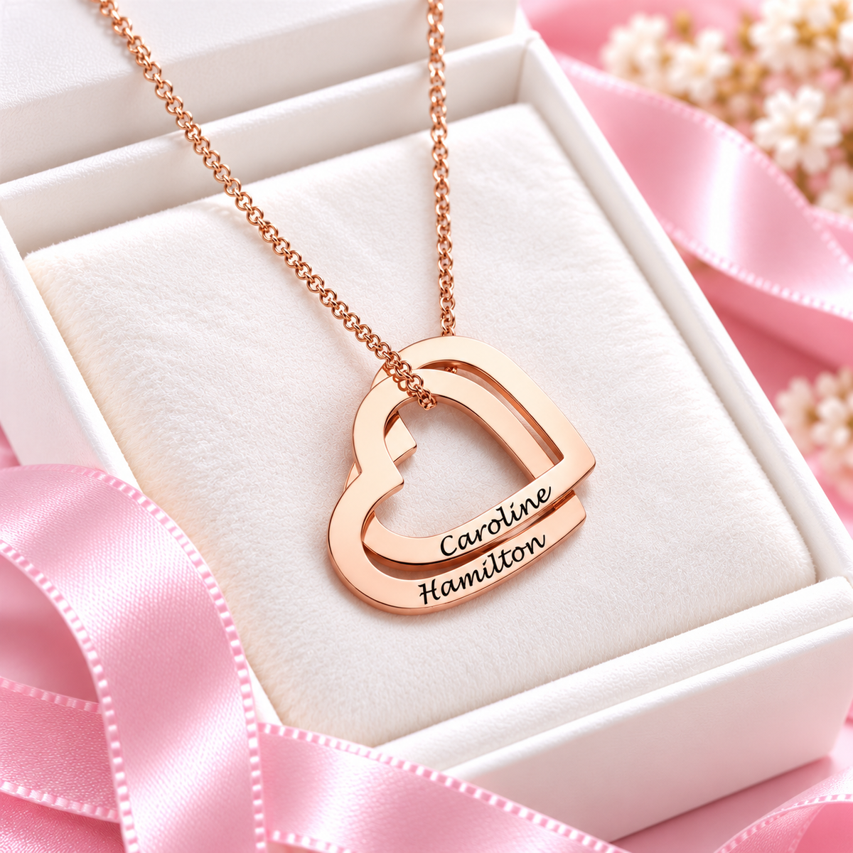 Rose gold interlocking hearts necklace with two custom engraved names