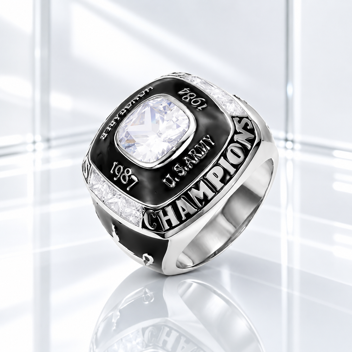 Personalized silver World Champion ring with black enamel, clear center stone, custom year and name engraving on a white glass background.