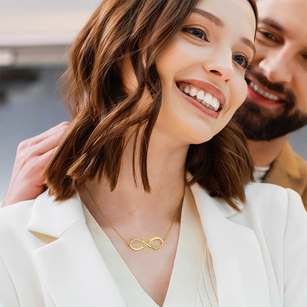 Woman wearing custom gold infinity name necklace