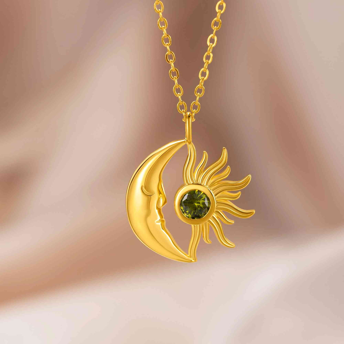 Gold moon and sun birthstone necklace worn on neck