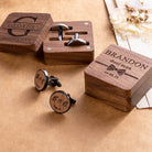 Personalized groomsman cufflinks and engraved walnut boxes displayed as wedding gifts