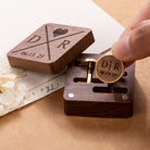 Hand displaying custom engraved cufflink with matching personalized wooden gift box