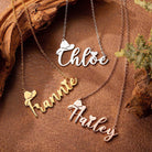 Personalized cowboy name necklaces in silver and gold finishes on rustic leather