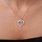 Close-up of silver personalized unicorn name necklace worn on neck