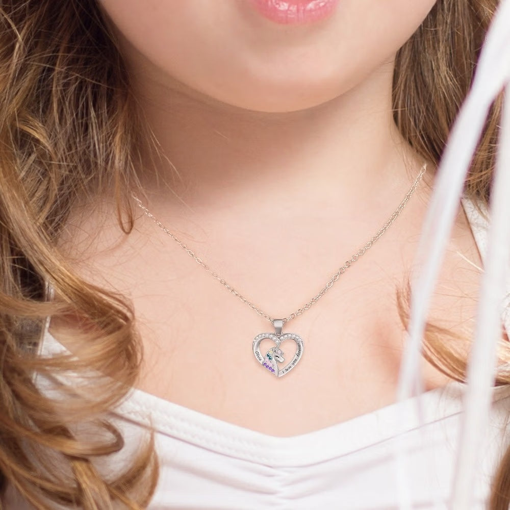 Girl wearing a personalized unicorn heart necklace