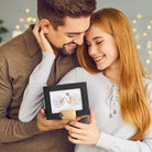 Couple holding a personalized map frame as a romantic relationship gift