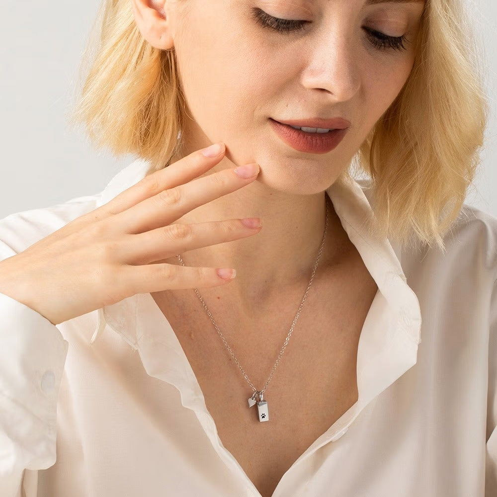 Woman wearing silver personalized memorial urn necklace