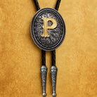 Custom bolo tie with gold letter P, engraved silver pendant, and braided black cord for personalized gifts.