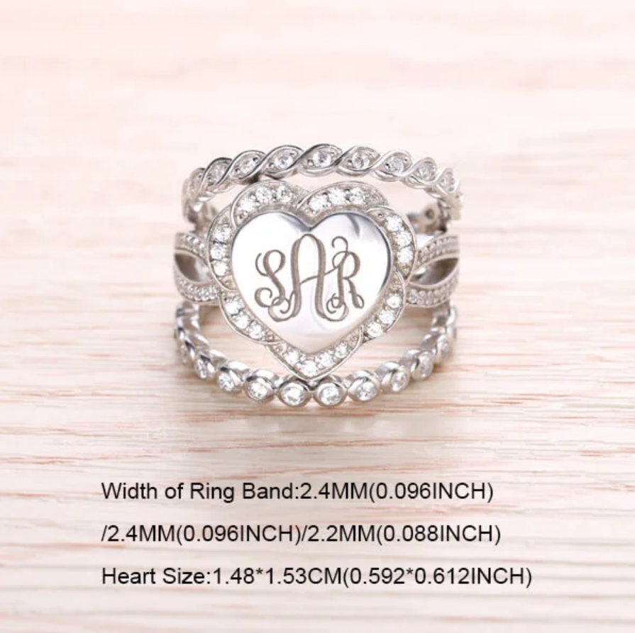A heart-shaped sterling silver stackable ring set with the monogram "SAR" surrounded by cubic zirconias, including detailed band width and heart size measurements.