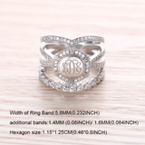 A hexagon-shaped sterling silver ring with central monogram "LDE" amidst cubic zirconias, flanked by detailed stackable bands with size specifications.