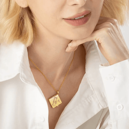 Woman wearing a gold Personalized Graduation Album Necklace featuring a custom photo pendant with engraved message, ideal graduation gift and keepsake.