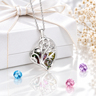 Sterling silver heart cage family tree necklace on black background