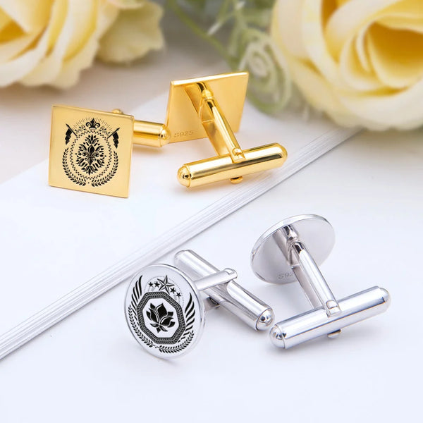 Elegant gold and silver cufflinks with engraved crests, perfect for personalized gifts and special occasions.
