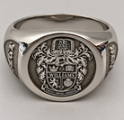 Personalised family crest signet ring with detailed coat of arms engraving and classic silver-tone finish.