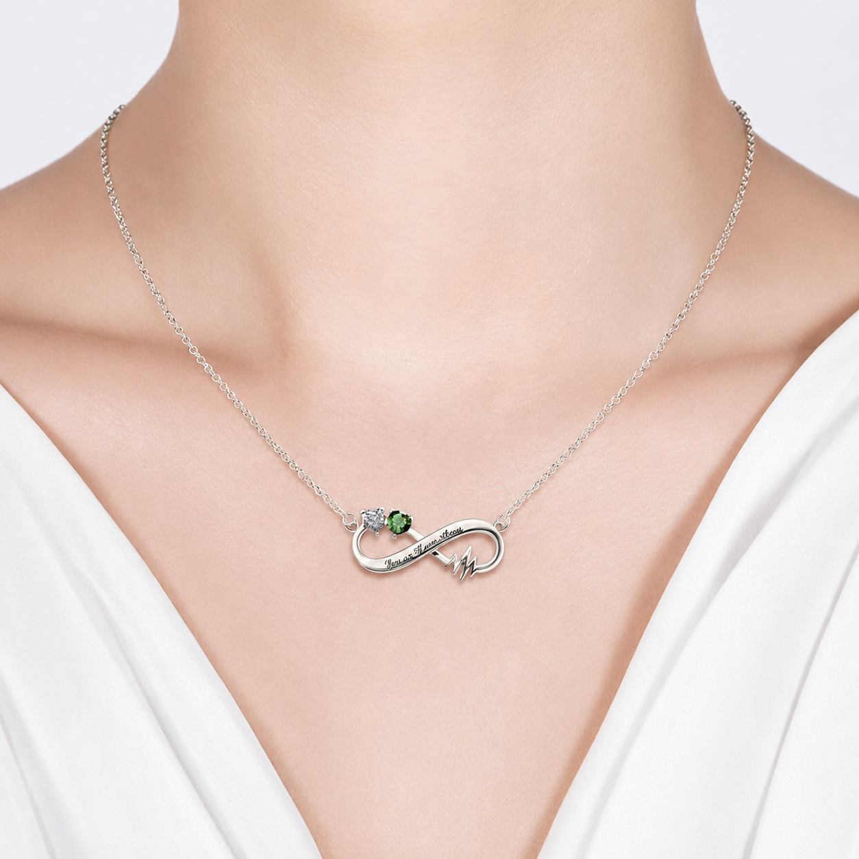 Heartbeat infinity necklace shown worn at the neckline
