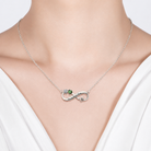 Heartbeat infinity necklace shown worn at the neckline