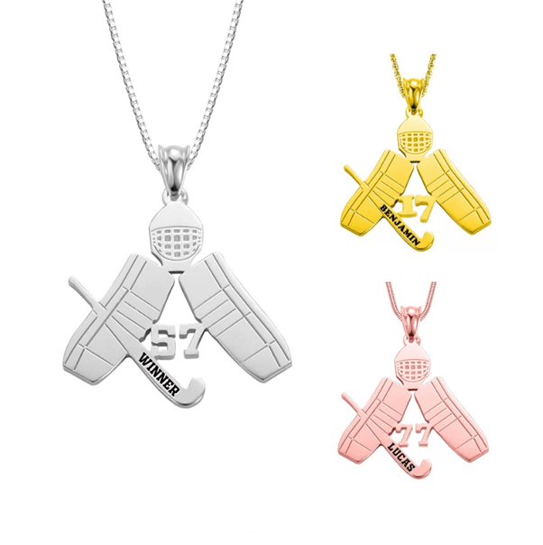 Three ice hockey-themed pendants in silver, gold, and rose gold featuring a goalie mask, crossed goalie pads, and a stick with personalized names and numbers.