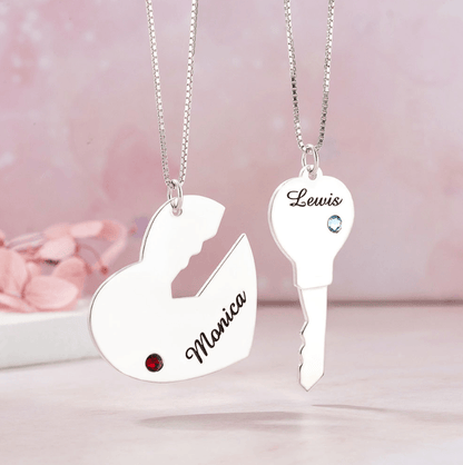 Personalized "Key to My Heart" couple necklace set with custom names and birthstones in sterling silver. Heart and key pendants for him and her.