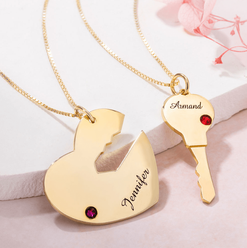 Gold personalized "Key to My Heart" couple necklace set with custom names Jennifer and Armand and birthstones. Heart and key pendants for him and her.