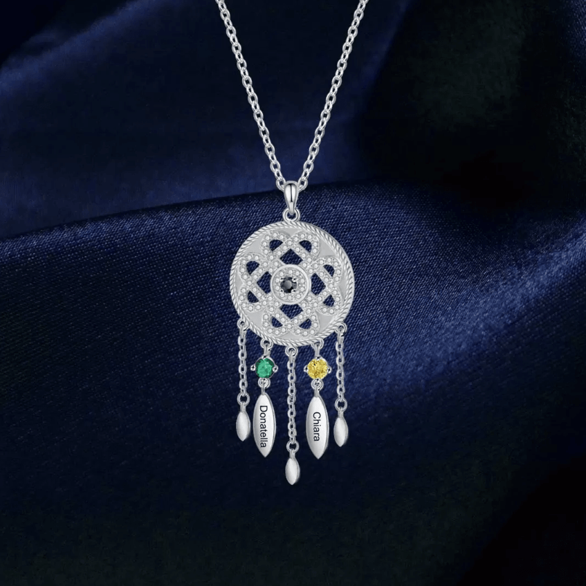 Silver pendant necklace with intricate pattern, gemstones, and name tags Daniella, Chiara, and Chiara.