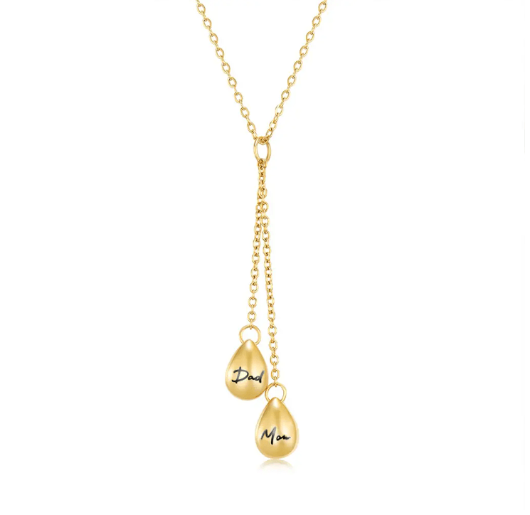 Gold Y-shaped necklace featuring two teardrop pendants engraved with 'Dad' and 'Mom' on a simple chain.