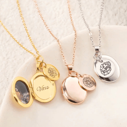 Three Personalized Birth Flower Necklaces with Oval Photo Lockets in Gold, Rose Gold, and Silver finishes, featuring custom engravings, displayed on a light surface.