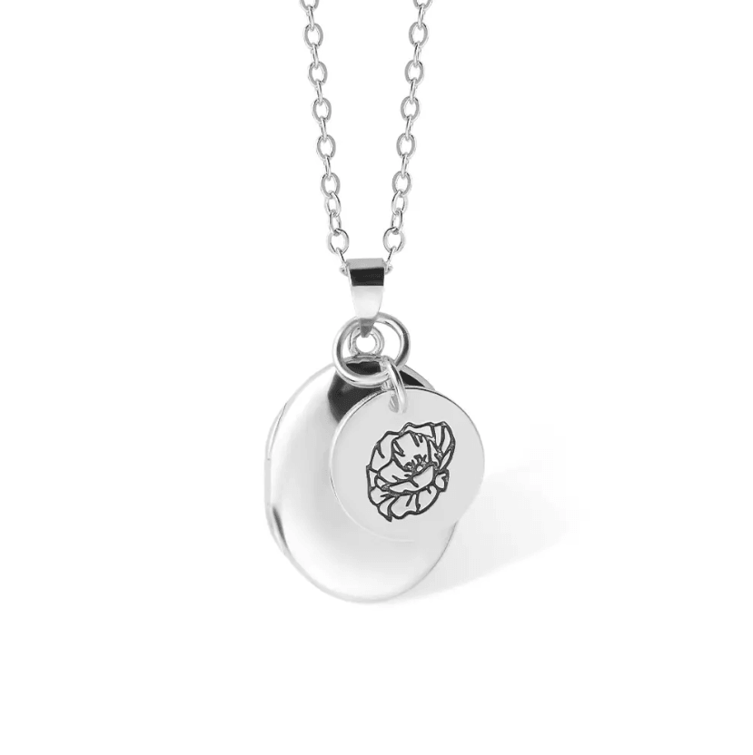 Silver Personalized Birth Flower Necklace with Oval Photo Locket, featuring a detailed flower engraving, displayed on a white background."
