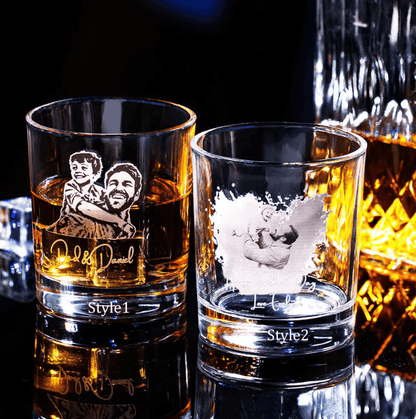 Two custom engraved whiskey glasses featuring family photos and personalized messages. One glass says "Dad & Daniel," and the other says "Happy Father's Day, Love Evelyn.
