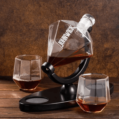Custom engraved diamond-shaped whiskey decanter set with two glasses on a wooden table, ideal for gifting.