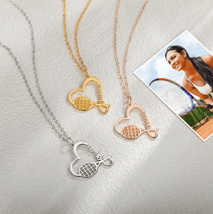  Three personalized tennis racket necklaces with heart charms in silver, gold, and rose gold finishes, displayed next to a photo of a female tennis player.