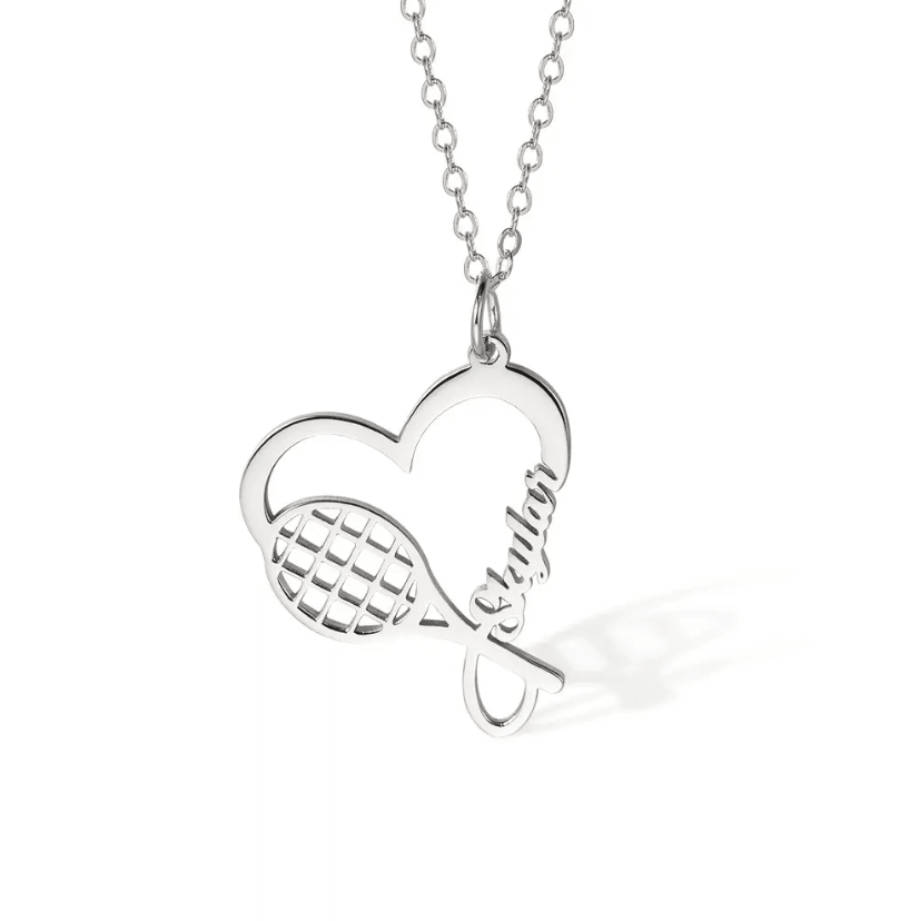 Silver tennis racket necklace with a heart charm, customized with the name "Skylar." Ideal sports jewelry gift for tennis enthusiasts and athletes.
