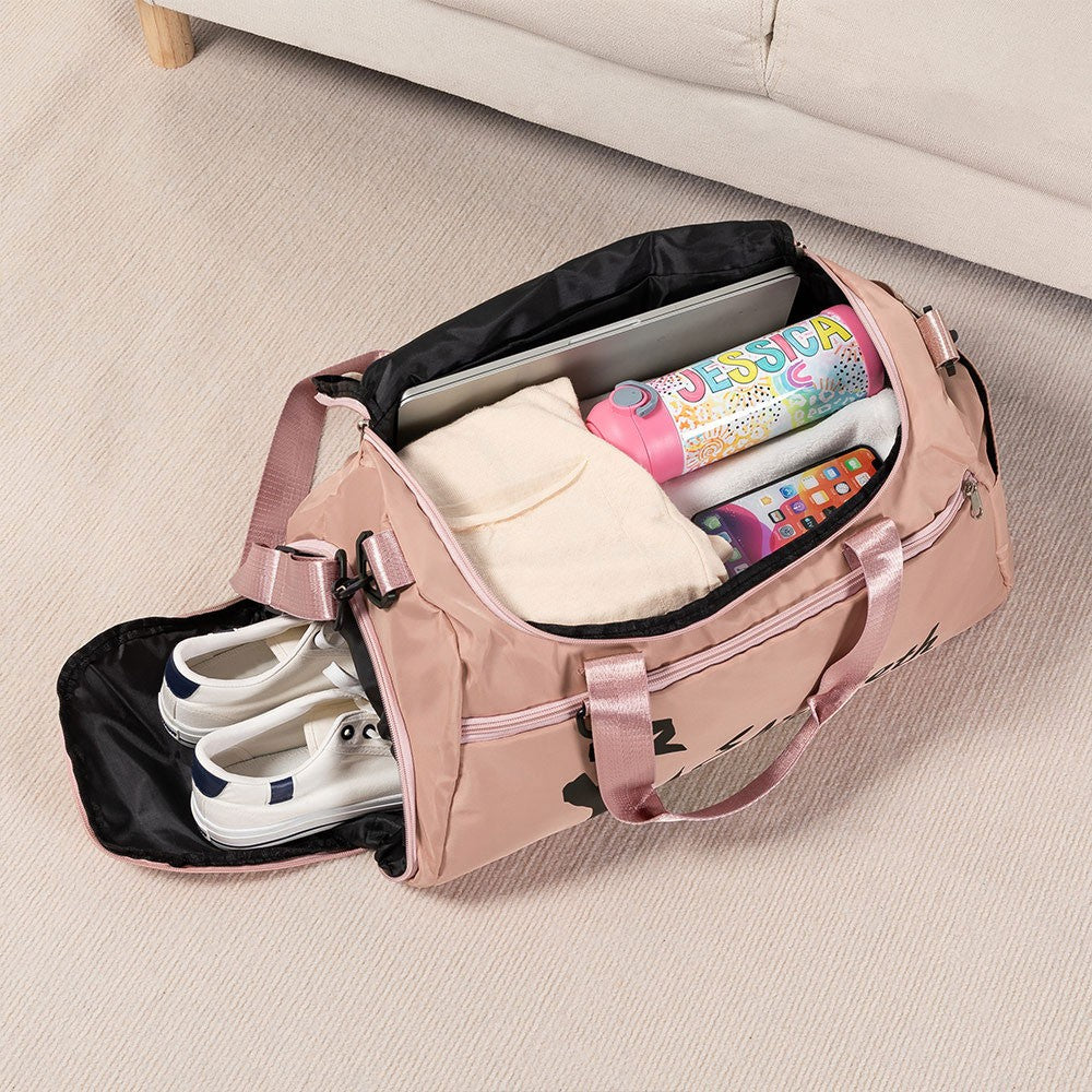 Open pink dance duffle bag showing spacious storage for shoes and clothing
