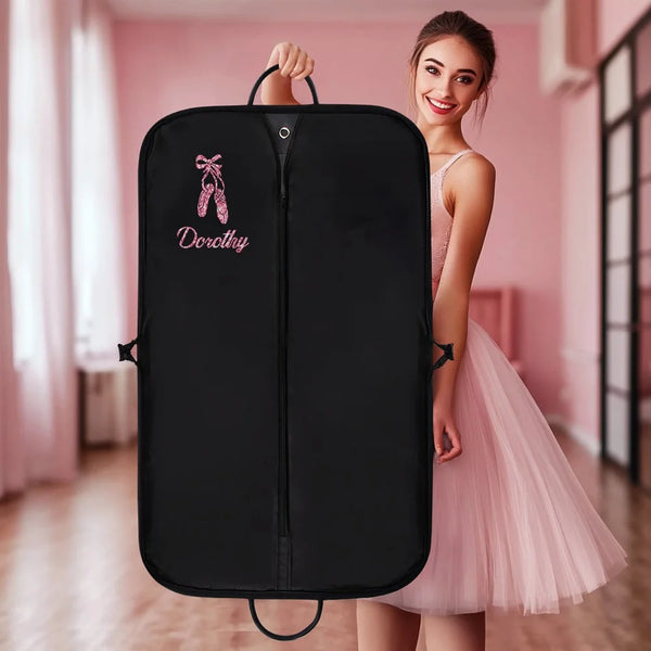 Personalized black garment bag with pink ballet shoes and name 'Dorothy', perfect for dancewear storage