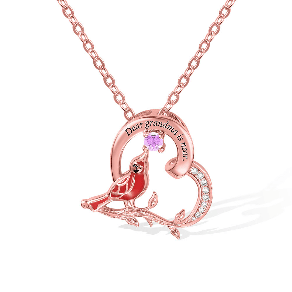 Rose gold 'Dear grandma is near' cardinal necklace with pink gemstone and chain.