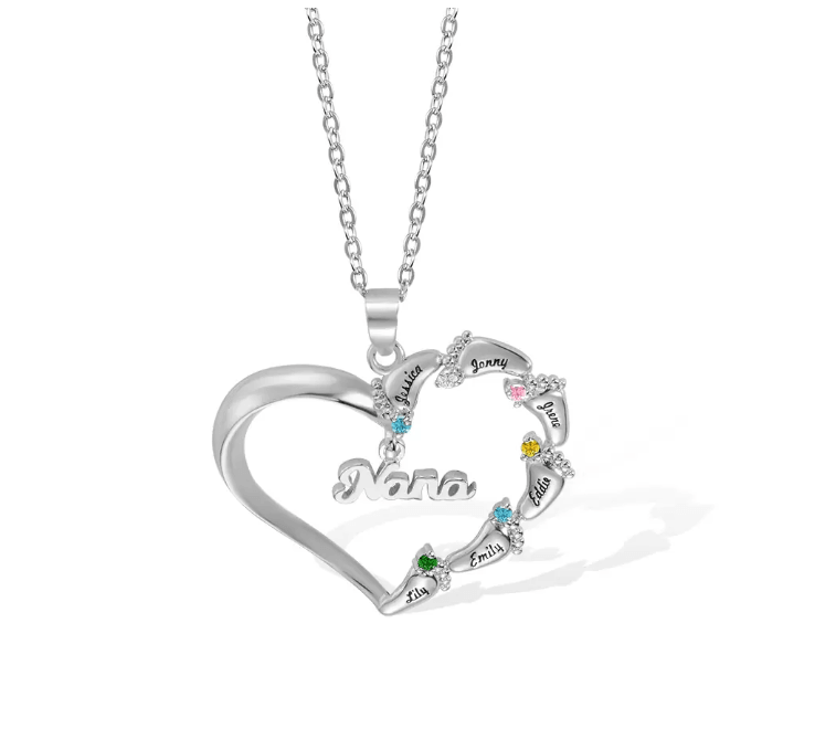 A silver heart-shaped necklace with "Nana" inscribed in the center, featuring eight names (Lily, Emily, Eddie, etc.) adorned with colorful gemstones around the edge.