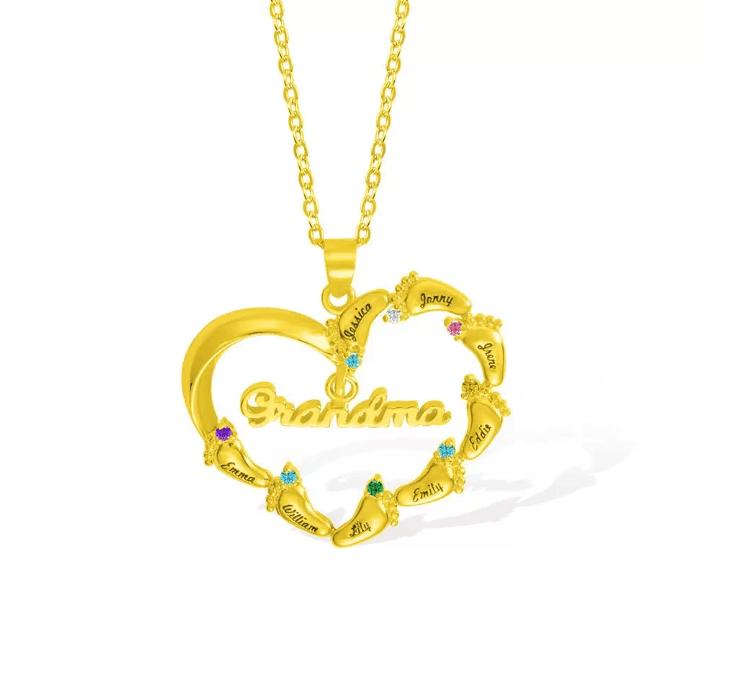 A gold heart-shaped necklace with "Grandma" inscribed, featuring eight names (Jessica, Jonny, Joyce, etc.) adorned with colorful gemstones around the edge.