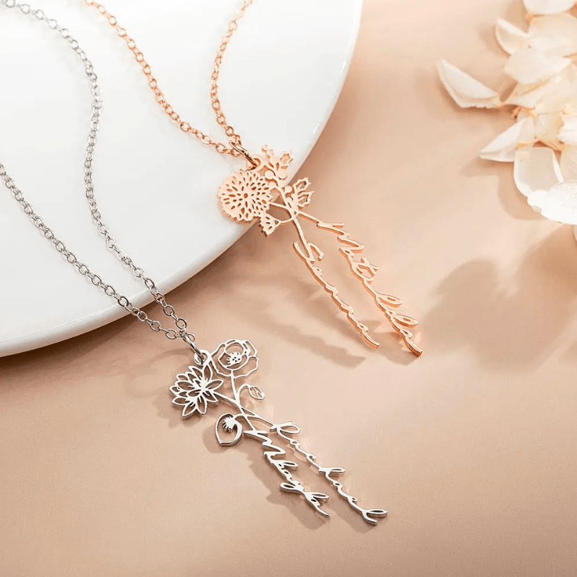 Two Personalized Birth Flower Necklaces in sterling silver and rose gold with custom names, showcasing delicate and intricate floral designs on a beige background.
