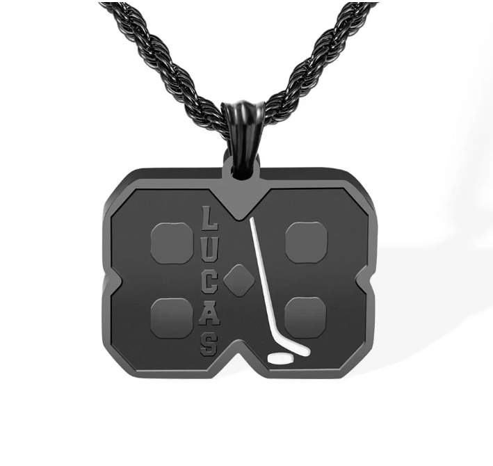 Black stainless steel hockey jersey pendant with 'LUCAS' and '18' engraved, on a twisted rope chain.
