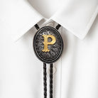 Personalized bolo tie with gold letter P on ornate silver pendant, worn on white shirt