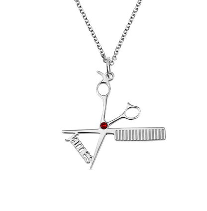 Personalized hairdresser necklace with scissors and comb pendant and the name 'James' in sterling silver.